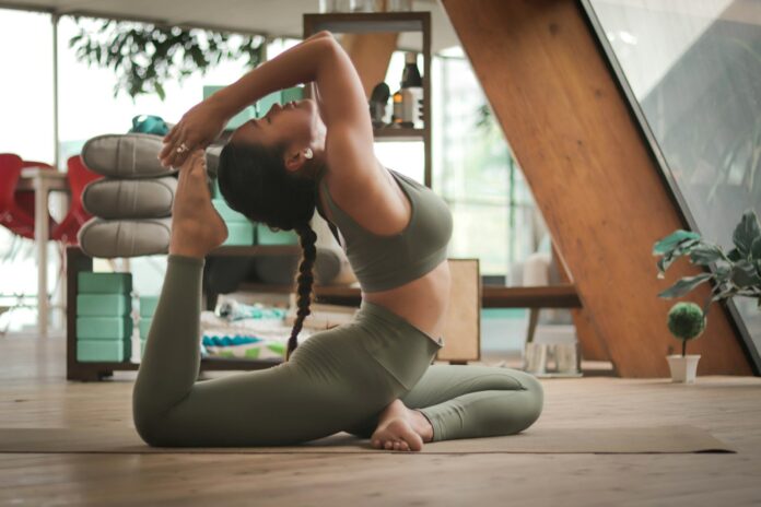 Photo by Carl Barcelo woman doing yoga