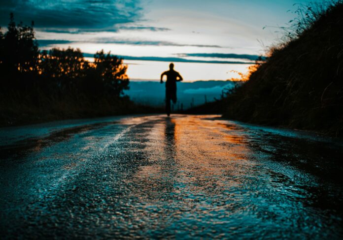 Photo by lucas Favre silhouette photo of a person running on road