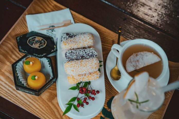 Photo by zero take white ceramic plate with food on brown wooden table