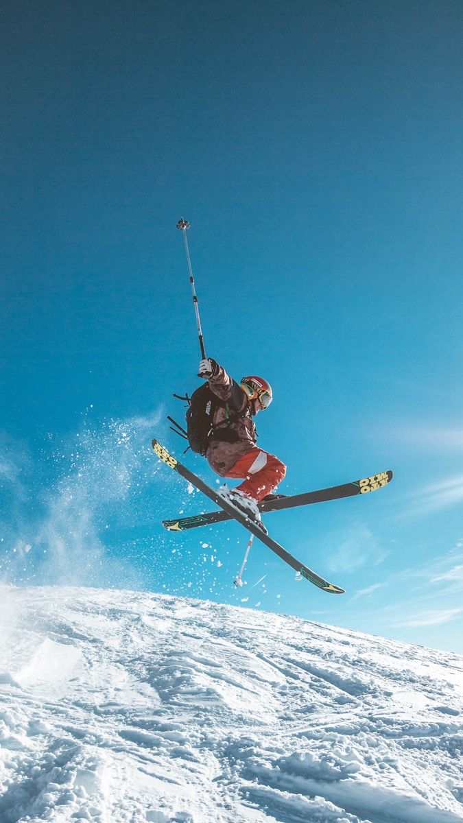 Photo by Matthieu Pétiard man skiing on land