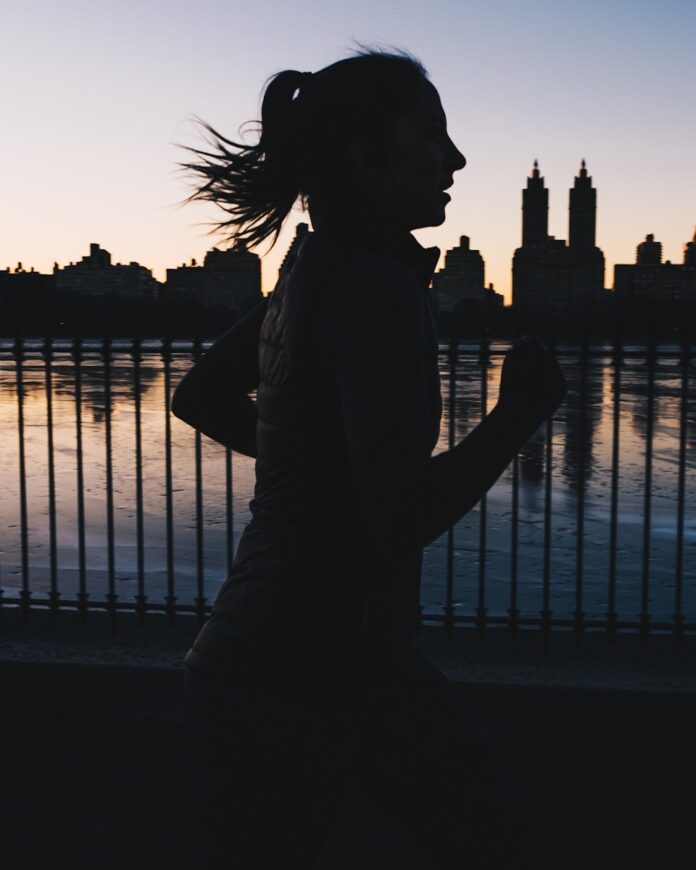 Photo by Zac Ong silhouette photo of woman running
