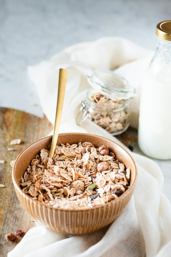 Photo by micheile henderson brown wooden bowl with brown wooden spoon