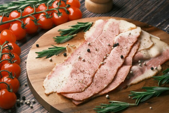 Photo by Towfiqu barbhuiya raw meat on brown wooden chopping board