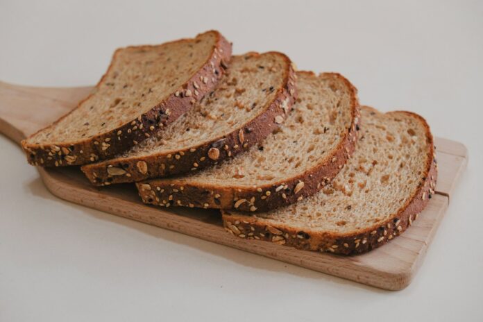 Photo by Young Shih brown bread on brown wooden tray
