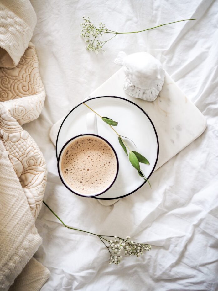 Photo by Jen P. white teacup filled with coffee